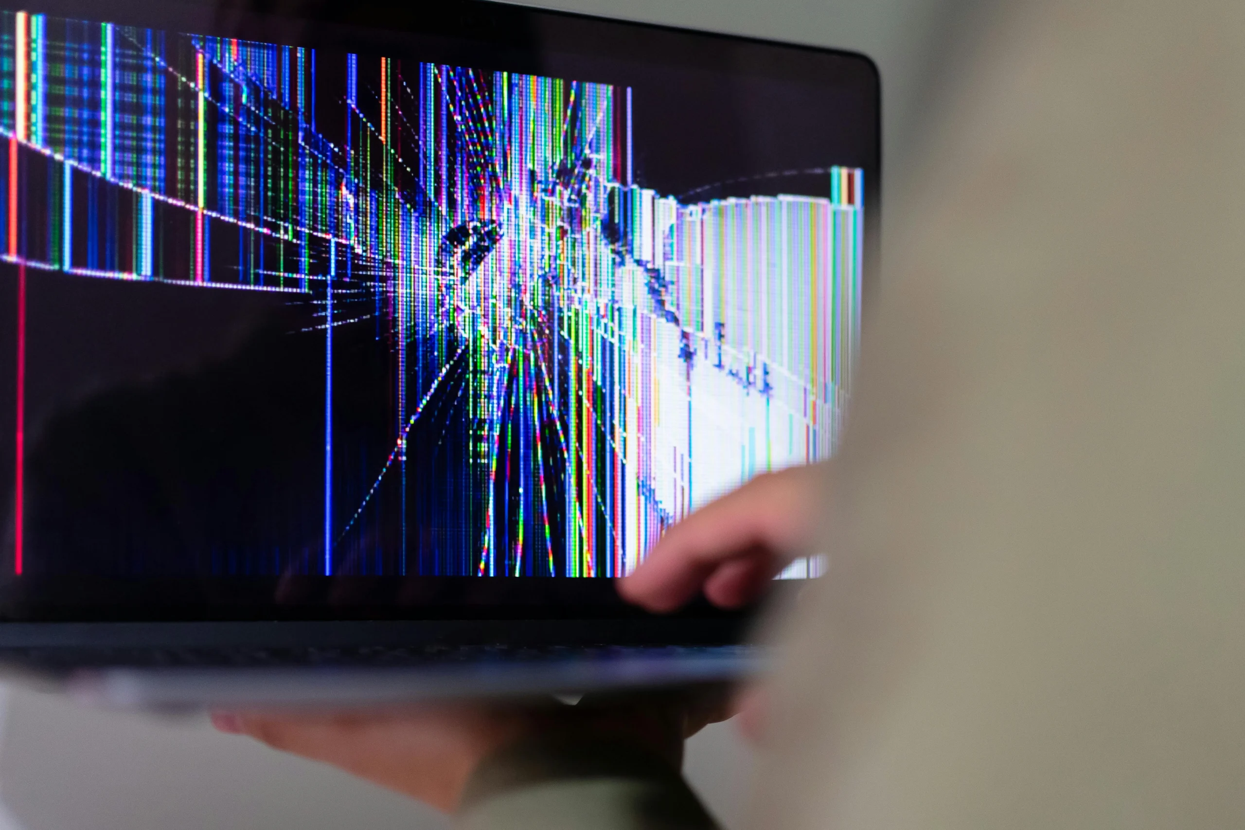 fake tech support scams often begin with urgent pop-up warnings on a laptop