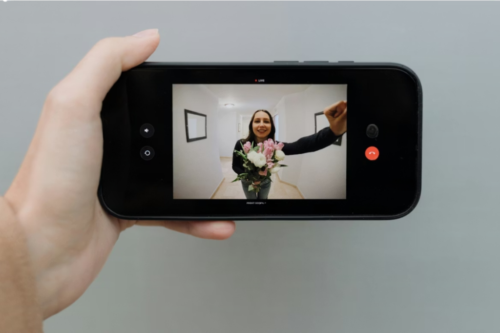 smartphone app showing smart doorbell features and live front door video